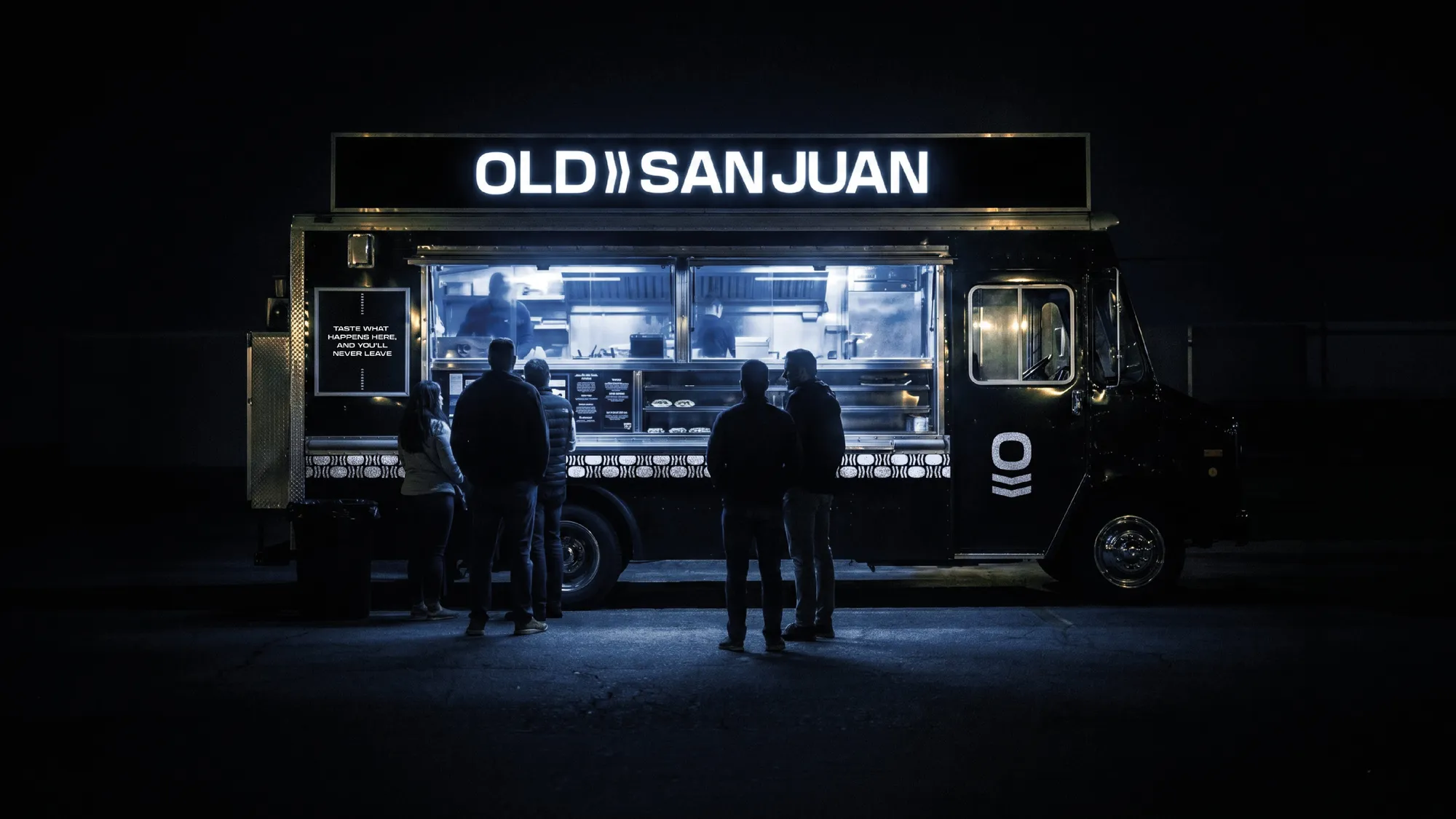 Old San Juan food trailer glowing at night